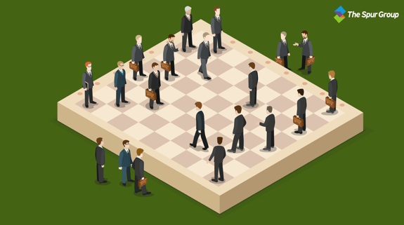 a chess board with people as the players