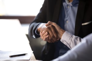 Two business people shaking hands